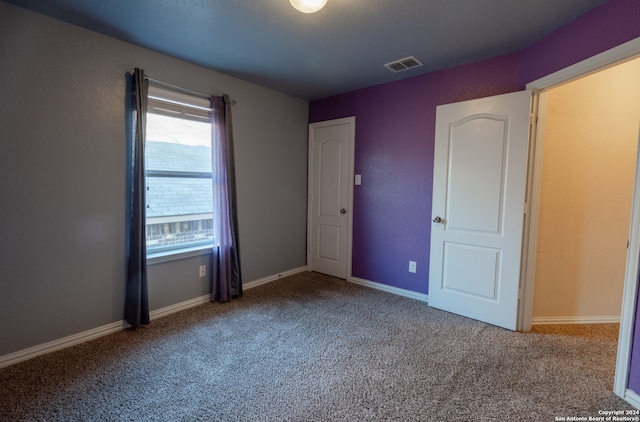 unfurnished bedroom featuring carpet floors