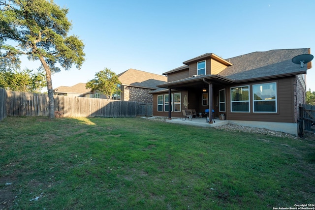7527 Presidio Hvn, Boerne, TX 78015 - back of property with a patio area, a lawn, and a fenced backyard