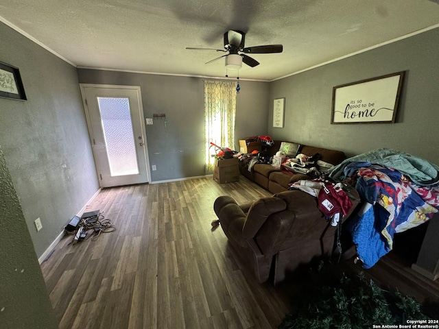 living room featuring crown molding, hardwood / wood-style floors, a textured ceiling, and ceiling fan