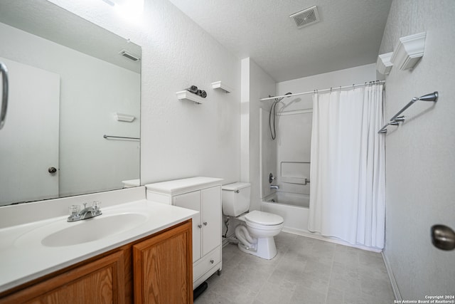 full bathroom featuring vanity, shower / bath combo, toilet, and a textured ceiling