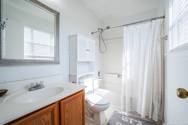 full bathroom featuring vanity, toilet, and shower / bath combo with shower curtain