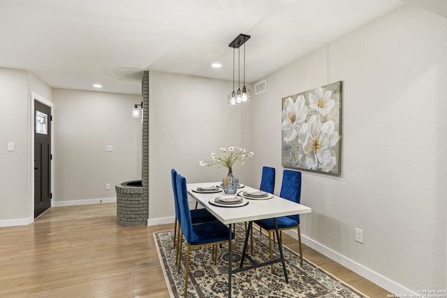 dining area featuring light wood-type flooring