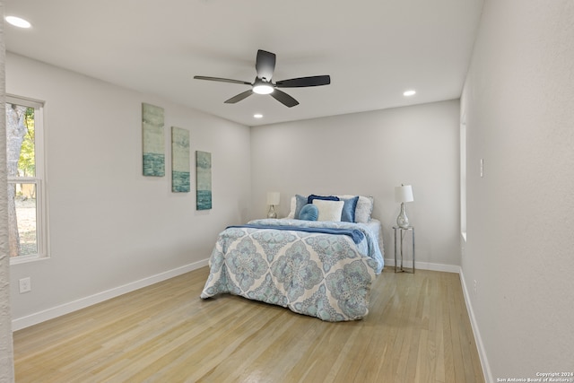 bedroom with hardwood / wood-style flooring and ceiling fan