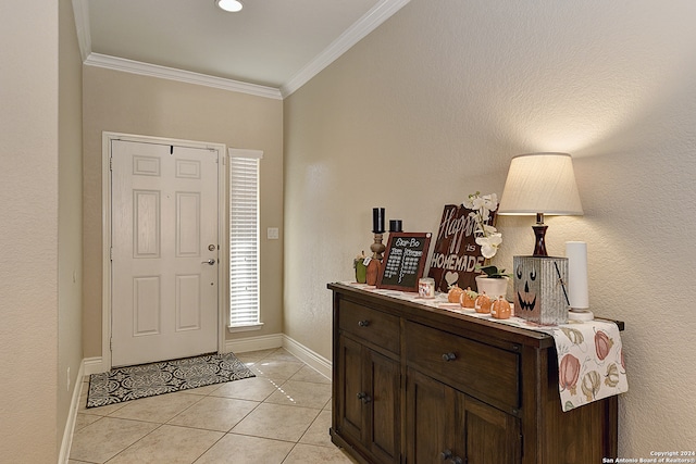 tiled foyer with crown molding