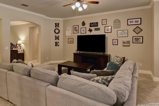 living room featuring crown molding, light tile patterned floors, and ceiling fan