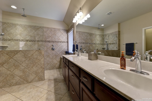 bathroom with vanity, tile patterned floors, and tiled shower