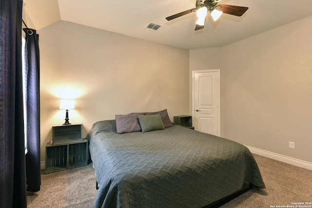 bedroom featuring lofted ceiling, carpet floors, and ceiling fan