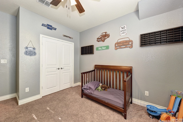 bedroom with a closet, carpet flooring, and ceiling fan