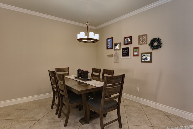 dining area featuring crown molding, light tile patterned flooring, and an inviting chandelier