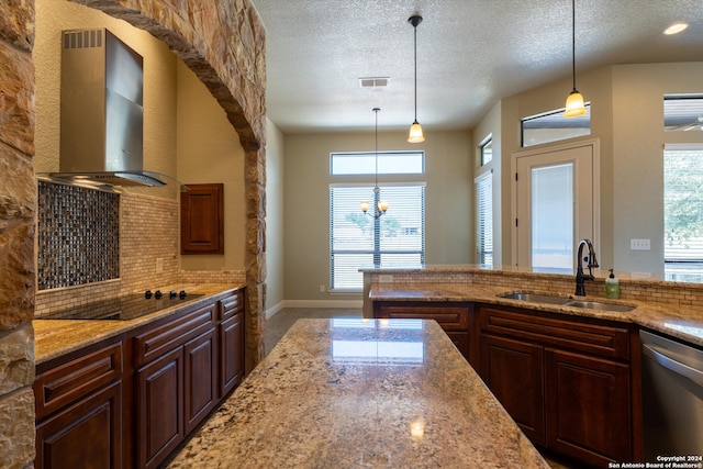 kitchen with sink, a textured ceiling, black electric cooktop, wall chimney exhaust hood, and decorative backsplash