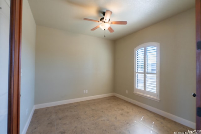 unfurnished room with ceiling fan