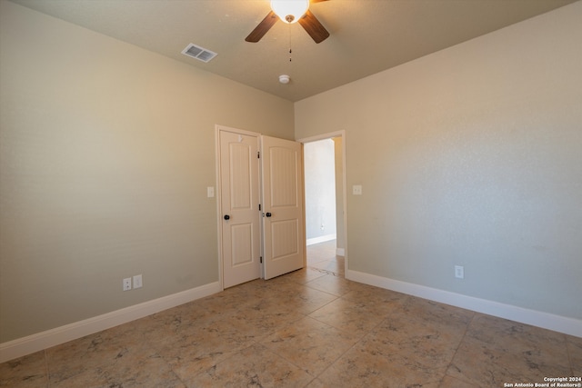 spare room featuring ceiling fan