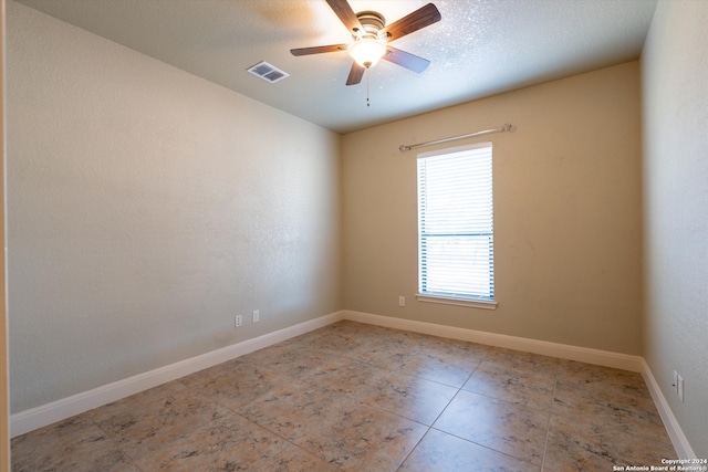 spare room with ceiling fan