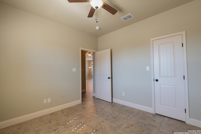 unfurnished bedroom featuring ceiling fan