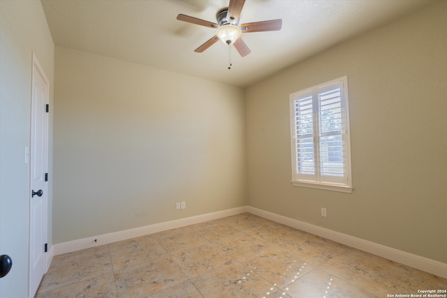 unfurnished room with ceiling fan