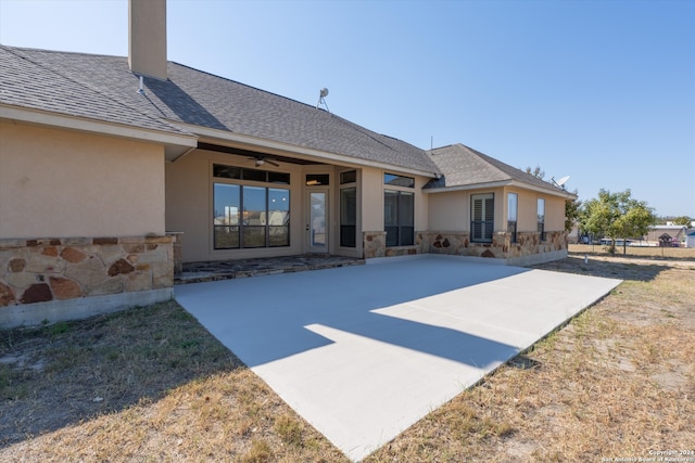 back of property featuring a patio and ceiling fan