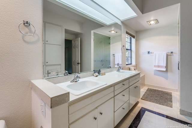 bathroom featuring vanity, an enclosed shower, and tile patterned flooring