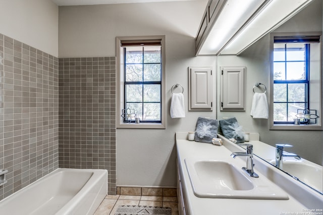 bathroom featuring vanity, tile patterned floors, and a washtub