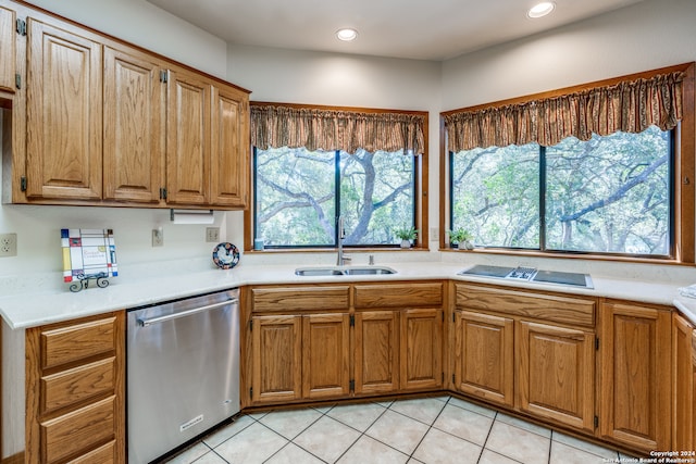 kitchen with stovetop, sink, dishwasher, and light tile patterned floors