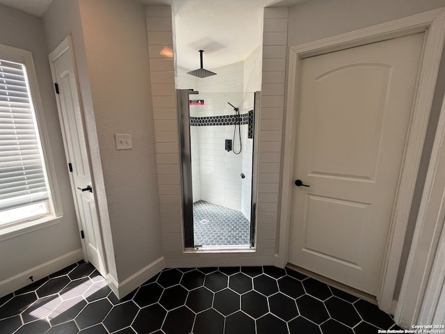 doorway featuring dark tile patterned floors