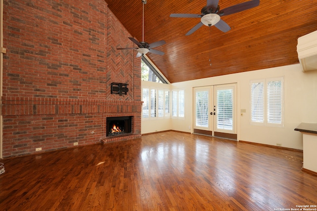 unfurnished living room featuring french doors, ceiling fan, a high ceiling, and plenty of natural light