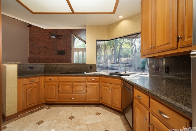 kitchen with stainless steel dishwasher, sink, plenty of natural light, and ceiling fan