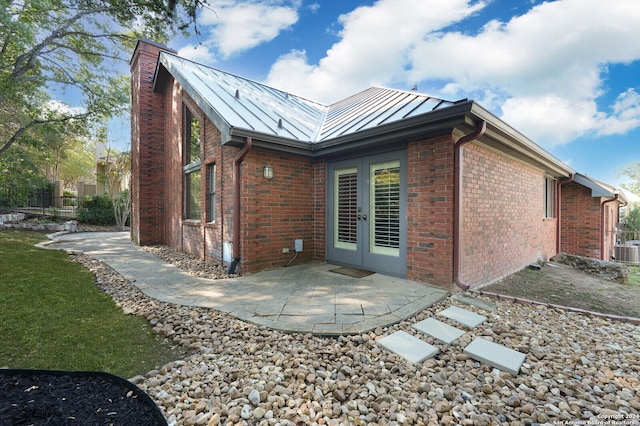 back of house featuring a patio and cooling unit