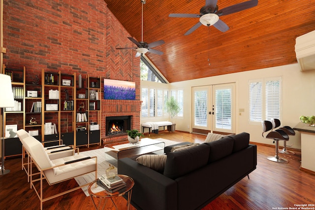 living room featuring french doors, wood-type flooring, a fireplace, high vaulted ceiling, and ceiling fan