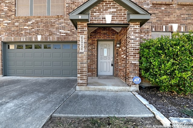 view of exterior entry featuring a garage