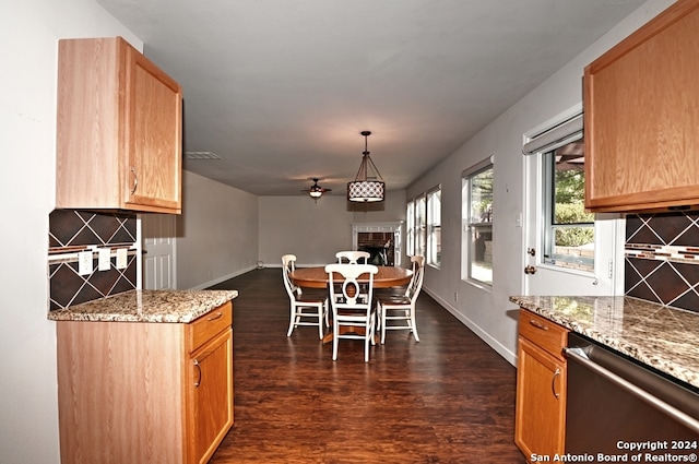 kitchen with dishwasher, decorative light fixtures, dark hardwood / wood-style floors, and tasteful backsplash