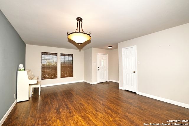 spare room with dark hardwood / wood-style floors