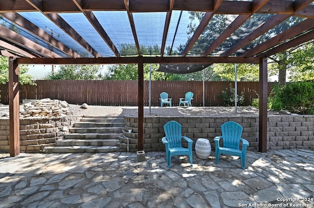 view of patio / terrace with an outdoor bar and a pergola