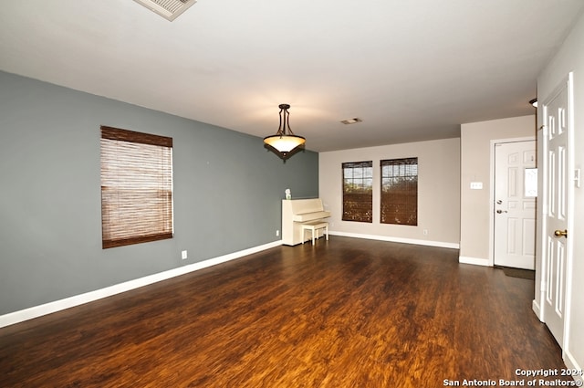 empty room featuring dark wood-type flooring