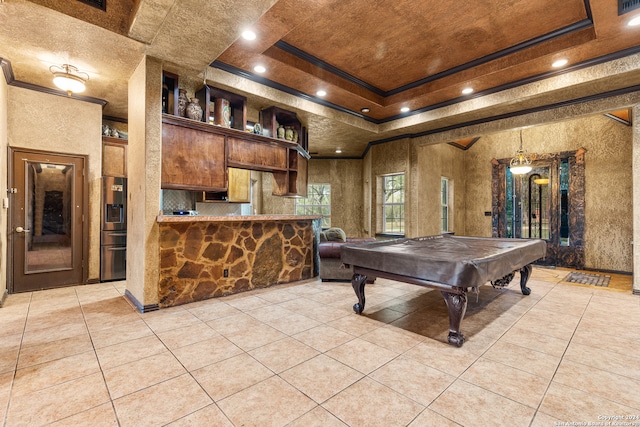 rec room with light tile patterned floors, crown molding, a tray ceiling, and pool table