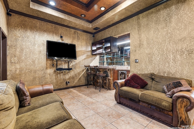 tiled living room with crown molding and a tray ceiling