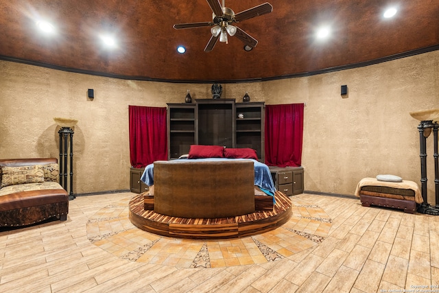 interior space featuring light hardwood / wood-style floors, ornamental molding, and ceiling fan