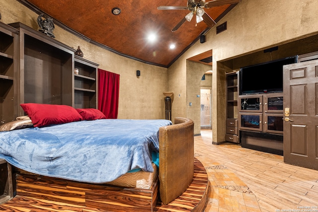 bedroom featuring crown molding, hardwood / wood-style flooring, high vaulted ceiling, and ceiling fan