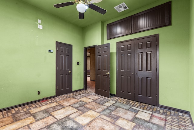 unfurnished bedroom featuring ceiling fan