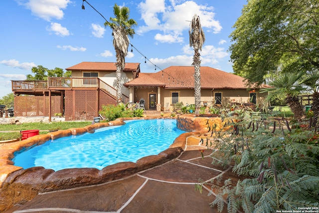 view of swimming pool featuring a deck