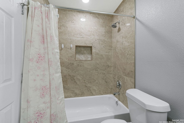 bathroom with toilet and shower / tub combo