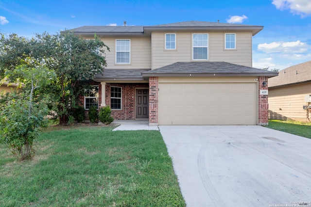 view of property featuring a front lawn and a garage