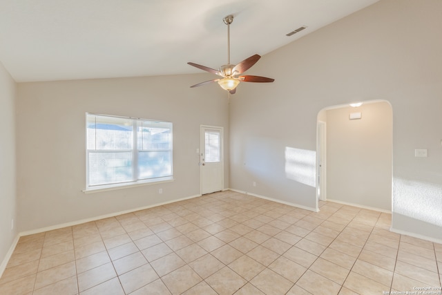 spare room featuring ceiling fan, high vaulted ceiling, and light tile patterned floors