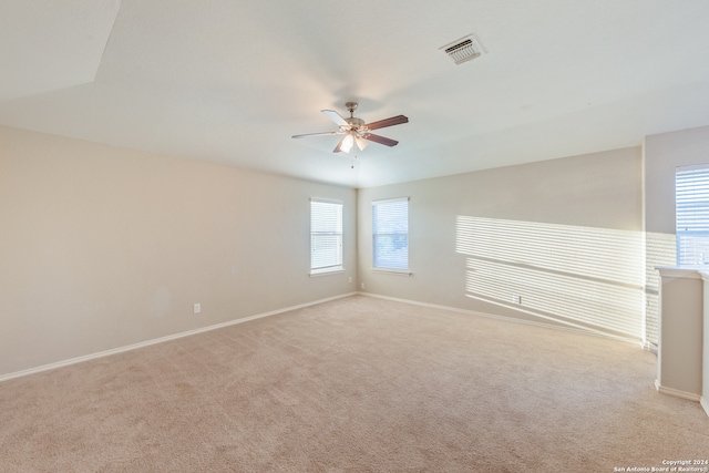 empty room with light carpet and ceiling fan