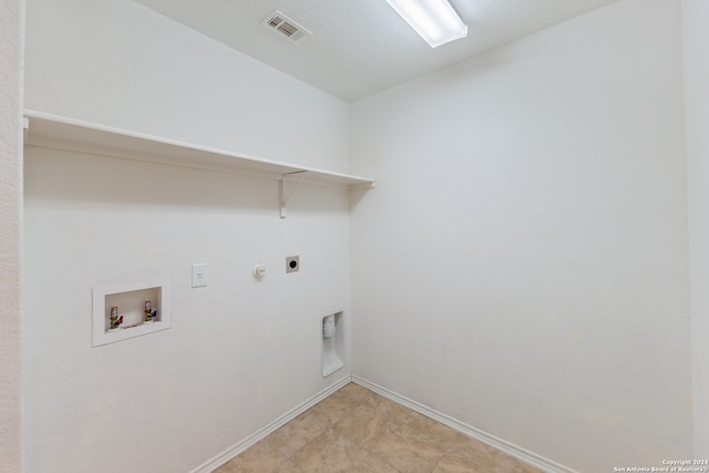 laundry area with hookup for a washing machine, electric dryer hookup, and hookup for a gas dryer