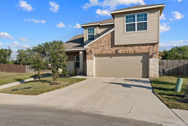 view of front facade featuring a garage and a front yard