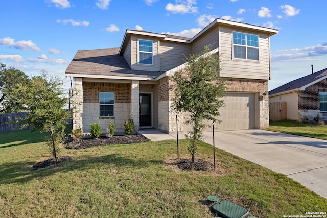 view of front facade with a front yard and a garage