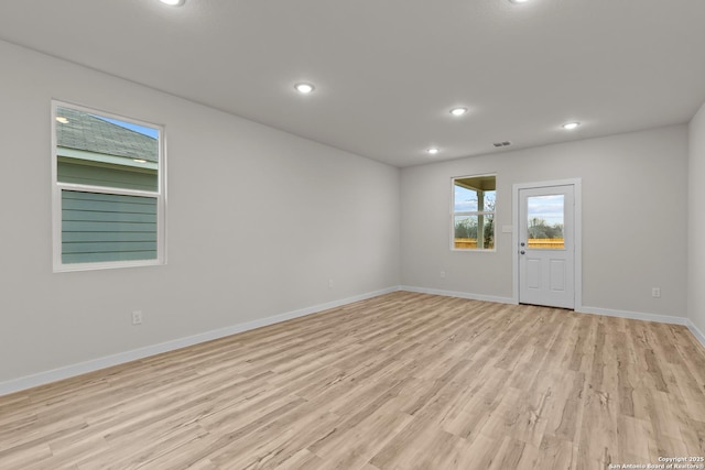 unfurnished room featuring light hardwood / wood-style flooring