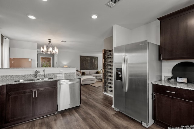 7011 Tradinghouse Ln, San Antonio, TX 78252 - kitchen with dark brown cabinets, visible vents, appliances with stainless steel finishes, and a sink