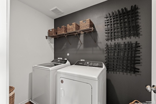 7011 Tradinghouse Ln, San Antonio, TX 78252 - clothes washing area featuring independent washer and dryer, visible vents, and laundry area