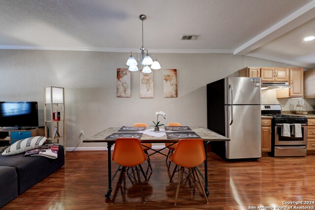 dining area featuring crown molding, vaulted ceiling with beams, a textured ceiling, dark hardwood / wood-style flooring, and a chandelier